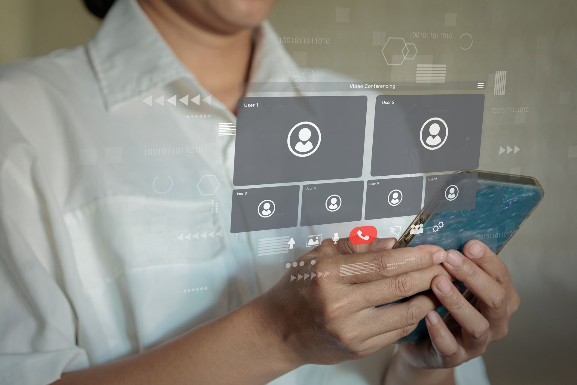 Person using smartphone displaying holographic video conference interface